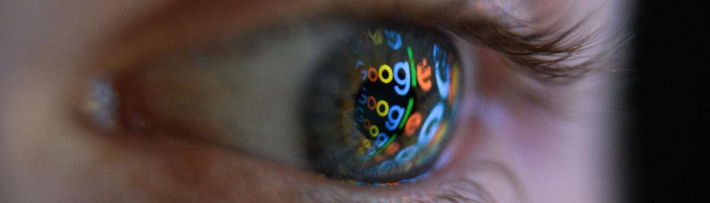 LONDON, ENGLAND &#8211; AUGUST 09:  In this photo illustration, an image of the Google logo is reflected on the eye of a young man on August 09, 2017 in London, England. Founded in 1995 by Sergey Brin and Larry Page, Google now makes hundreds of products used by billions of people across the globe, from YouTube and Android to Smartbox and Google Se...