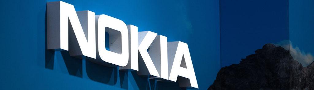 BARCELONA, SPAIN &#8211; FEBRUARY 28: A logo sits illuminated outside the Nokia booth at the SK telecom booth on day 1 of the GSMA Mobile World Congress on February 28, 2022 in Barcelona, Spain. The annual Mobile World Congress hosts some of the world&#8217;s largest communications companies, with many unveiling their latest phones and wearables ga...