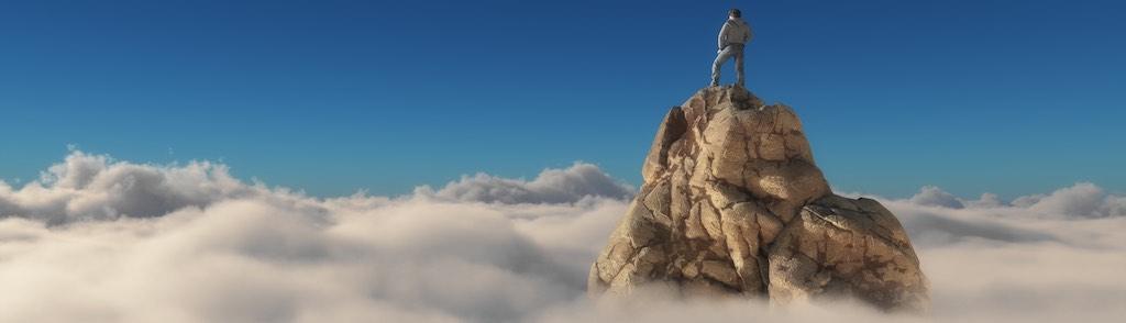 A man standing on a stone cliff over the clouds .Success concept. This is a 3d render illustration