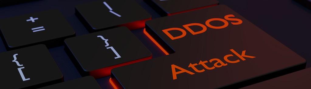 Black computer keyboard with the words DDOS attack on the enter key distributed denial of service concept 3D illustration