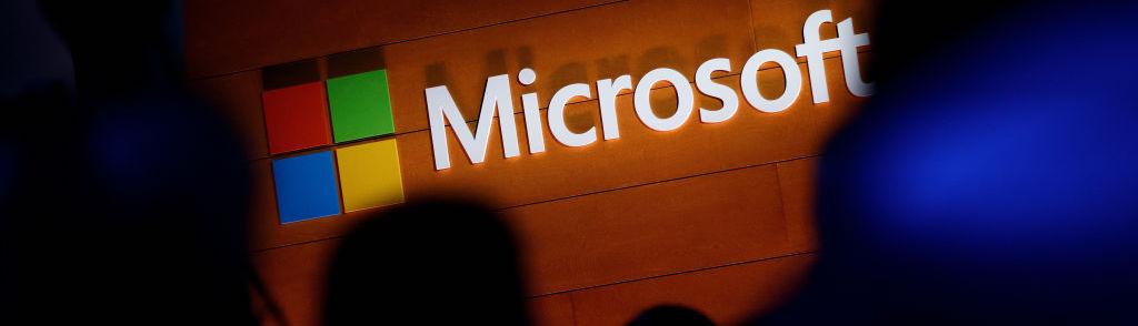 NEW YORK, NY &#8211; MAY 2: The Microsoft logo is illuminated on a wall during a Microsoft launch event to introduce the new Microsoft Surface laptop and Windows 10 S operating system, May 2, 2017 in New York City. The Windows 10 S operating system is geared toward the education market and is Microsoft&#8217;s answer to Google&#8217;s Chrome OS. (P...